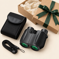 Contenu du pack spectacle : jumelles 10×25, étui, sangle et emballage cadeau